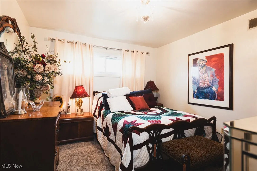 Bedroom with dark carpet