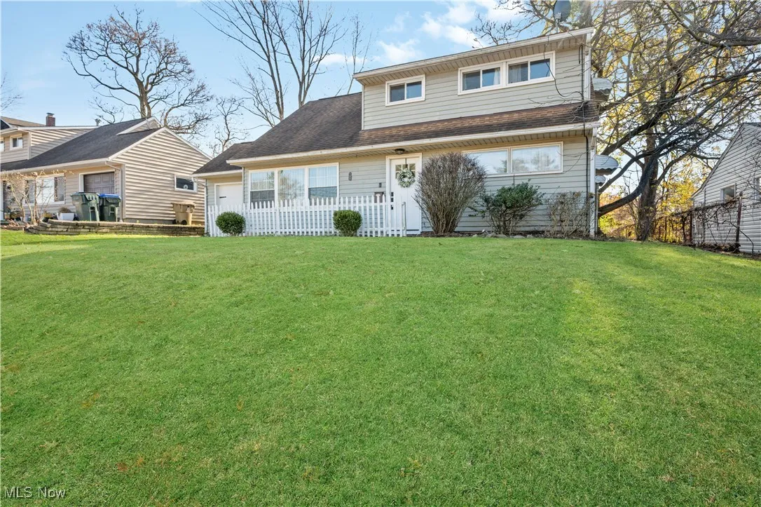 Front of property with a lawn