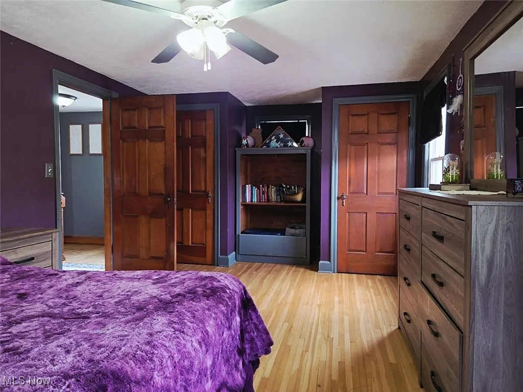 Bedroom featuring light wood-style flooring and ceiling fan