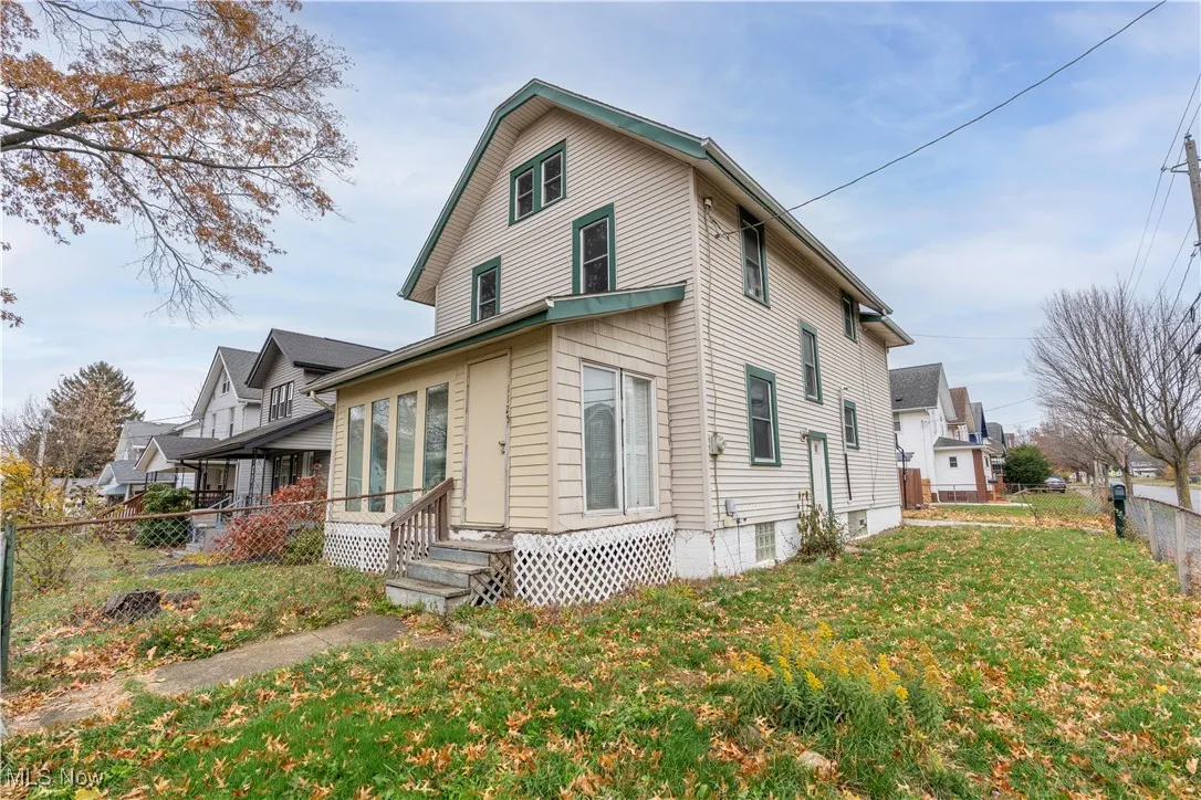 View of side of property featuring entry steps