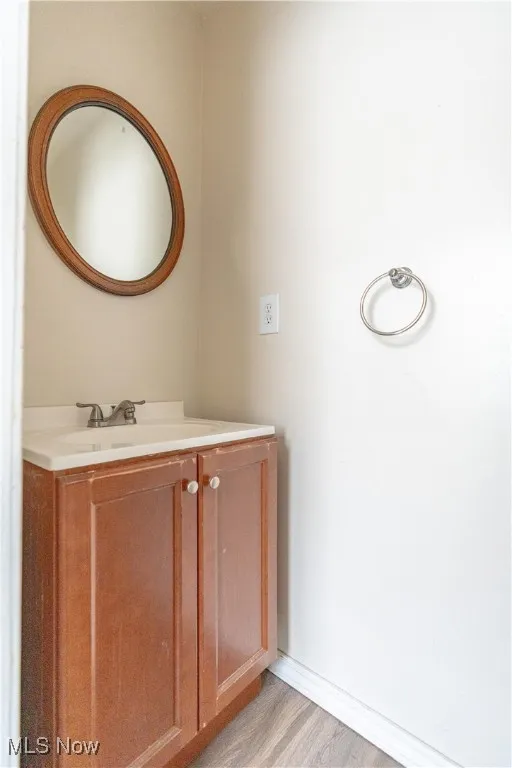 Bathroom with vanity and light wood-style flooring