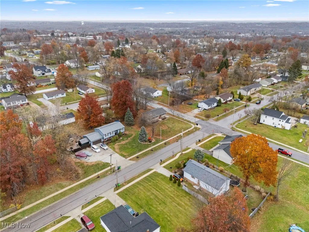 Aerial overview of property's location with nearby suburban area