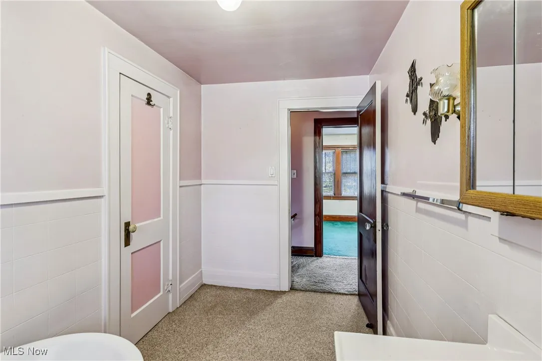 Another view of the bathroom looking into hallway