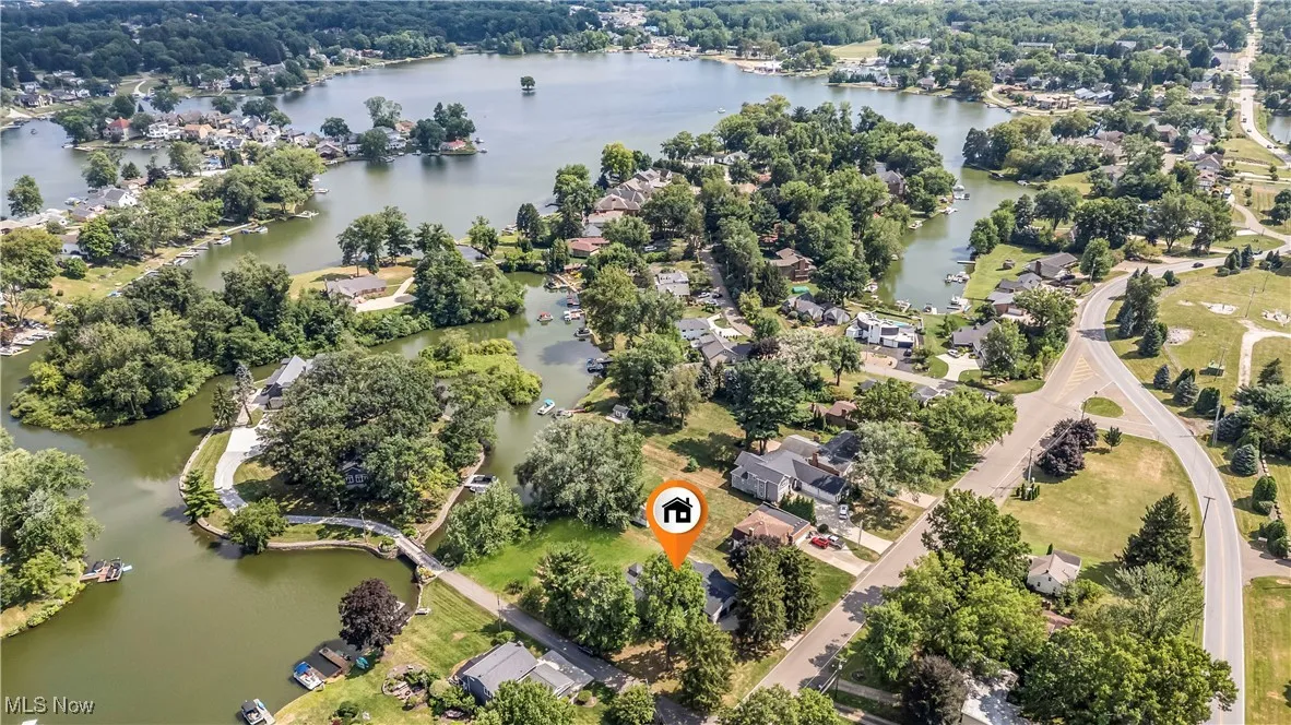 Aerial view of property's location featuring a nearby body of water