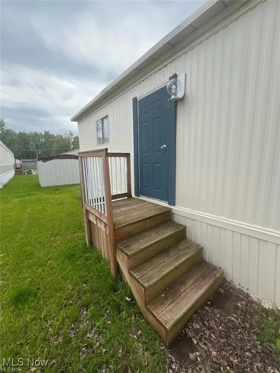 Entrance to property with a yard