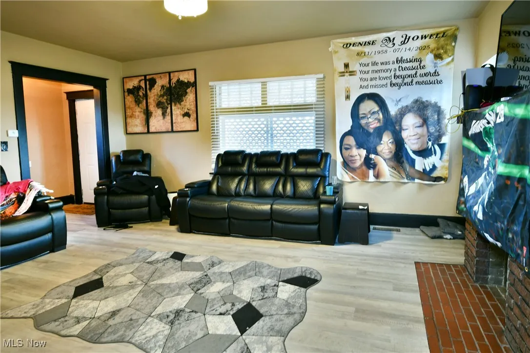 Living room with wood finished floors and baseboards