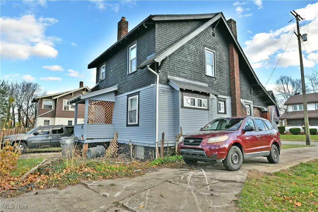 View of property exterior with a chimney
