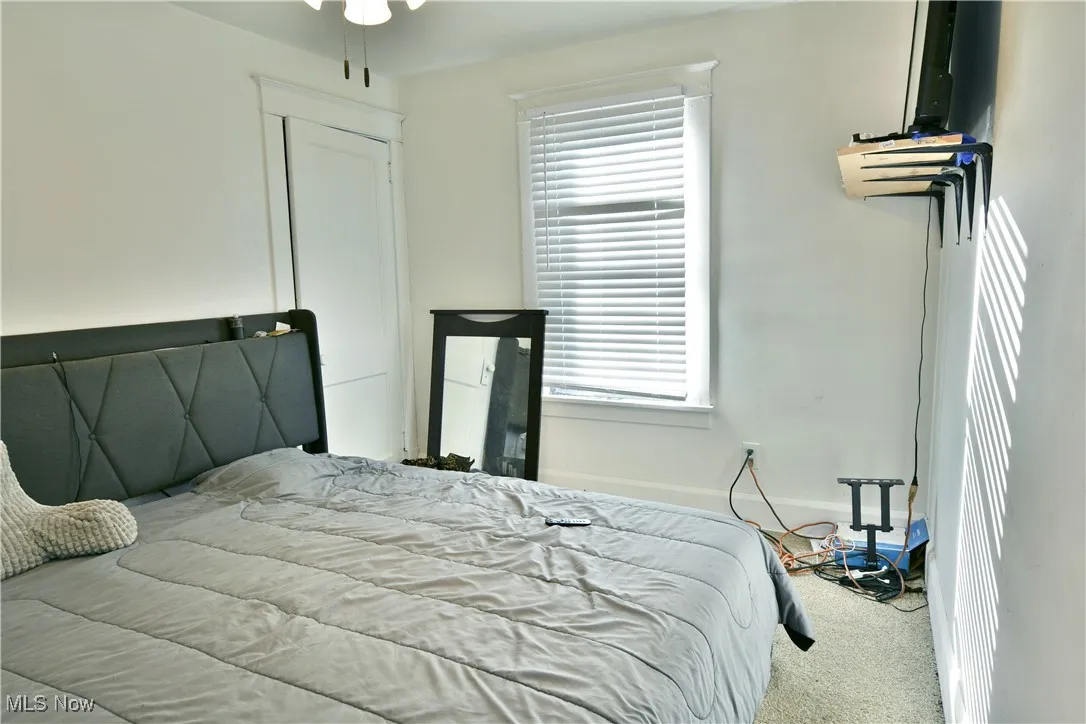 Carpeted bedroom with baseboards