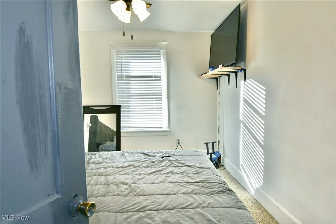 Bedroom featuring carpet floors and a ceiling fan