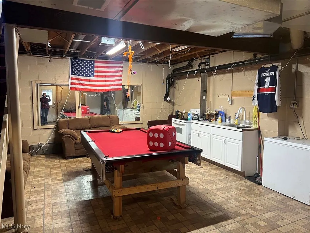 Recreation room featuring brick patterned flooring and billiards