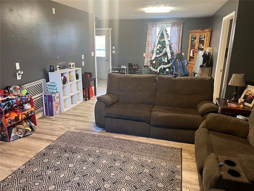 Living area with light wood-type flooring