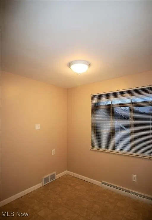 Bedroom with wood flooring
