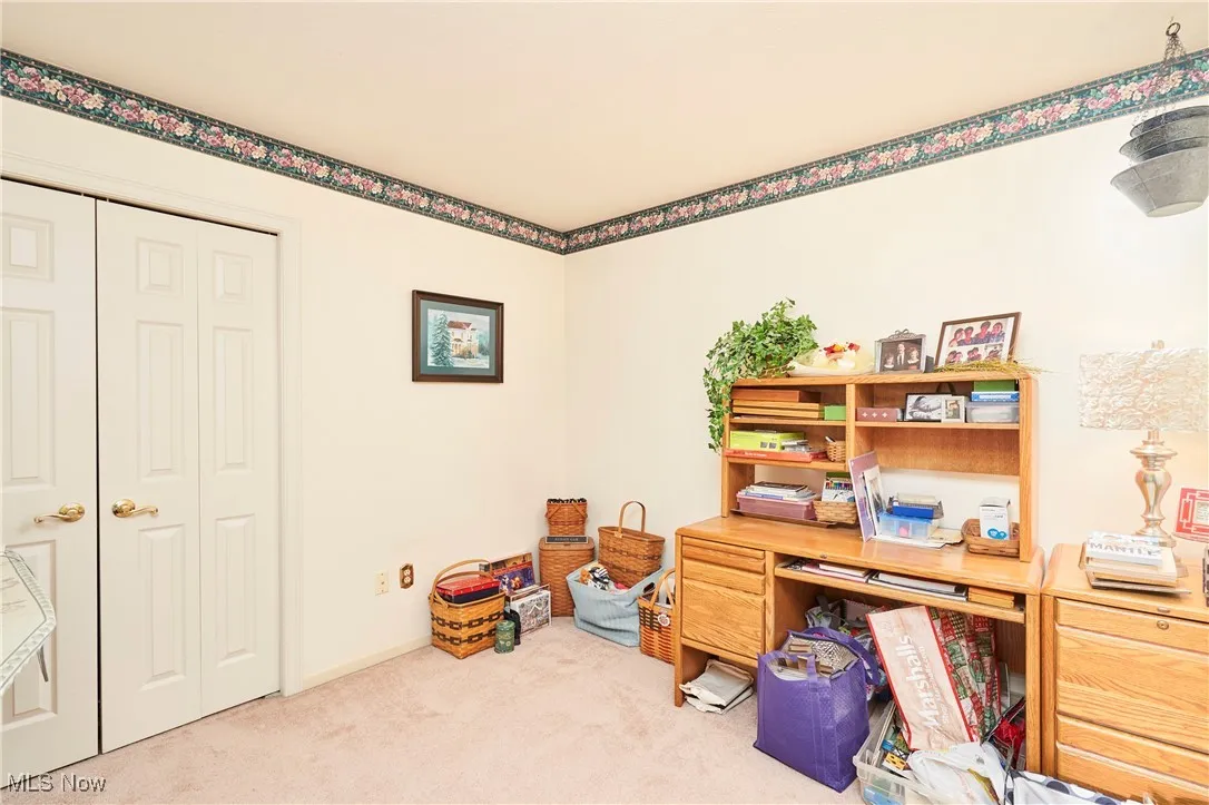 Office with carpet flooring and baseboards