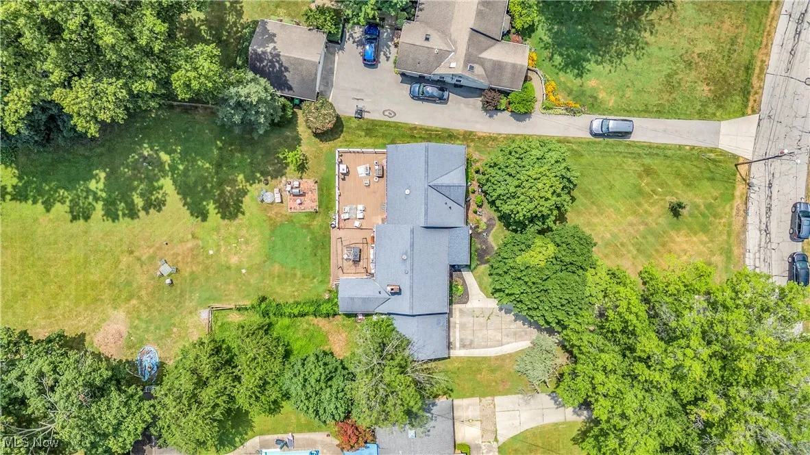Aerial view of residential area with a tree filled landscape