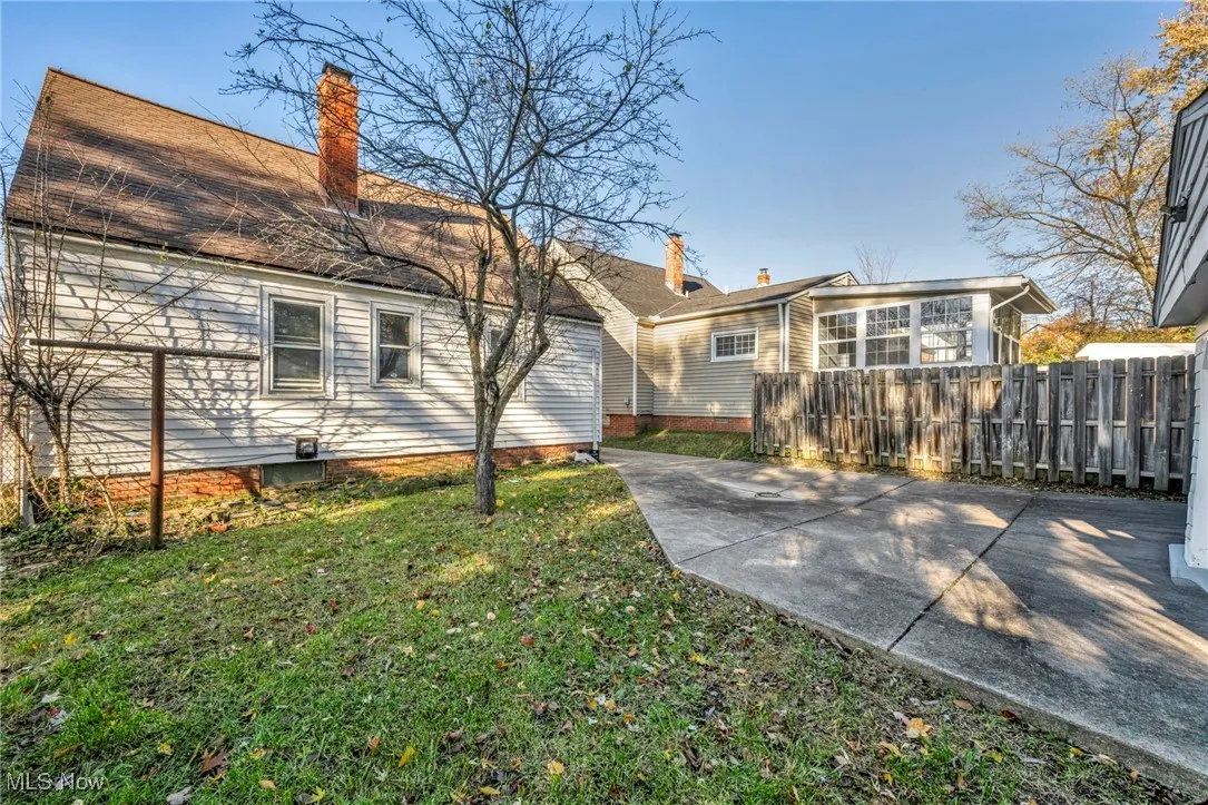 Back of property featuring a patio and a chimney