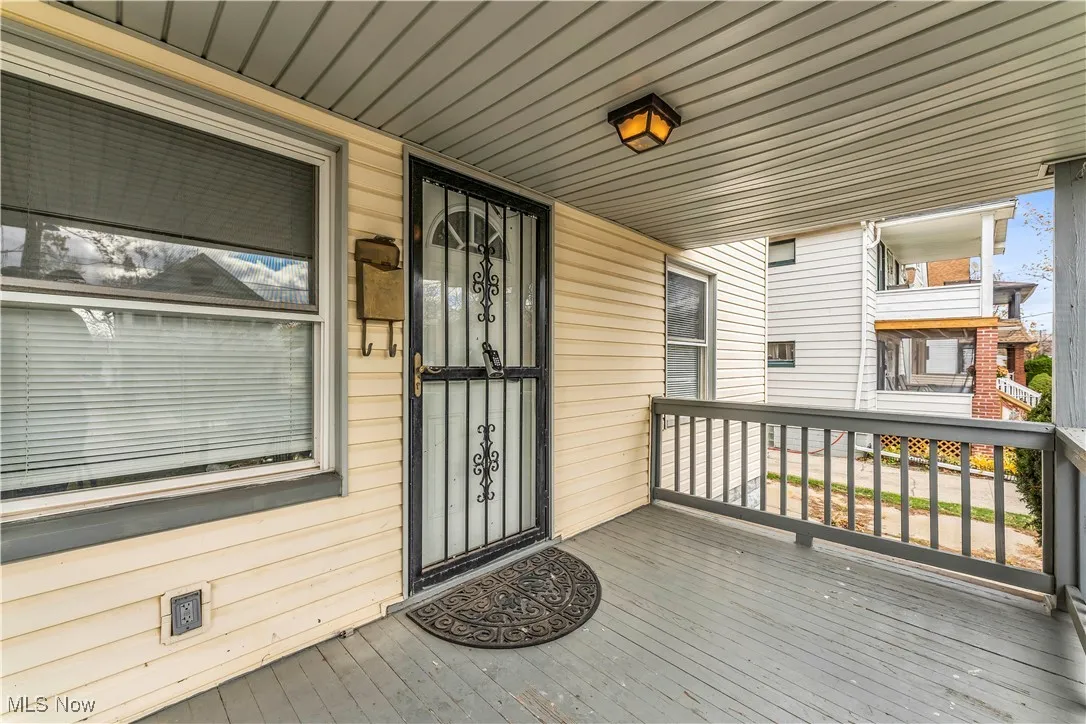 View of exterior entry with covered porch