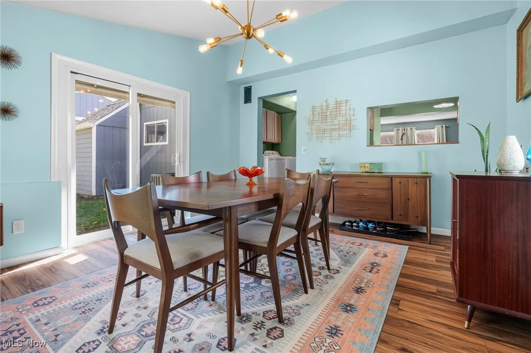 Dining room featuring a chandelier and wood finished floors