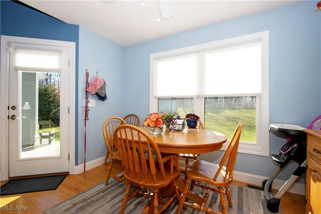 Dining room featuring light wood-style flooring and a ceiling fan
