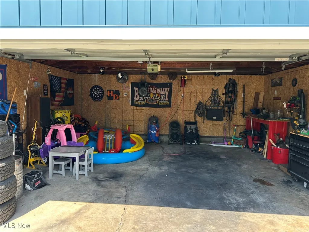 Garage featuring a garage door opener