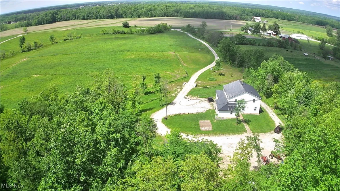 Aerial view of property and surrounding area with rural landscape