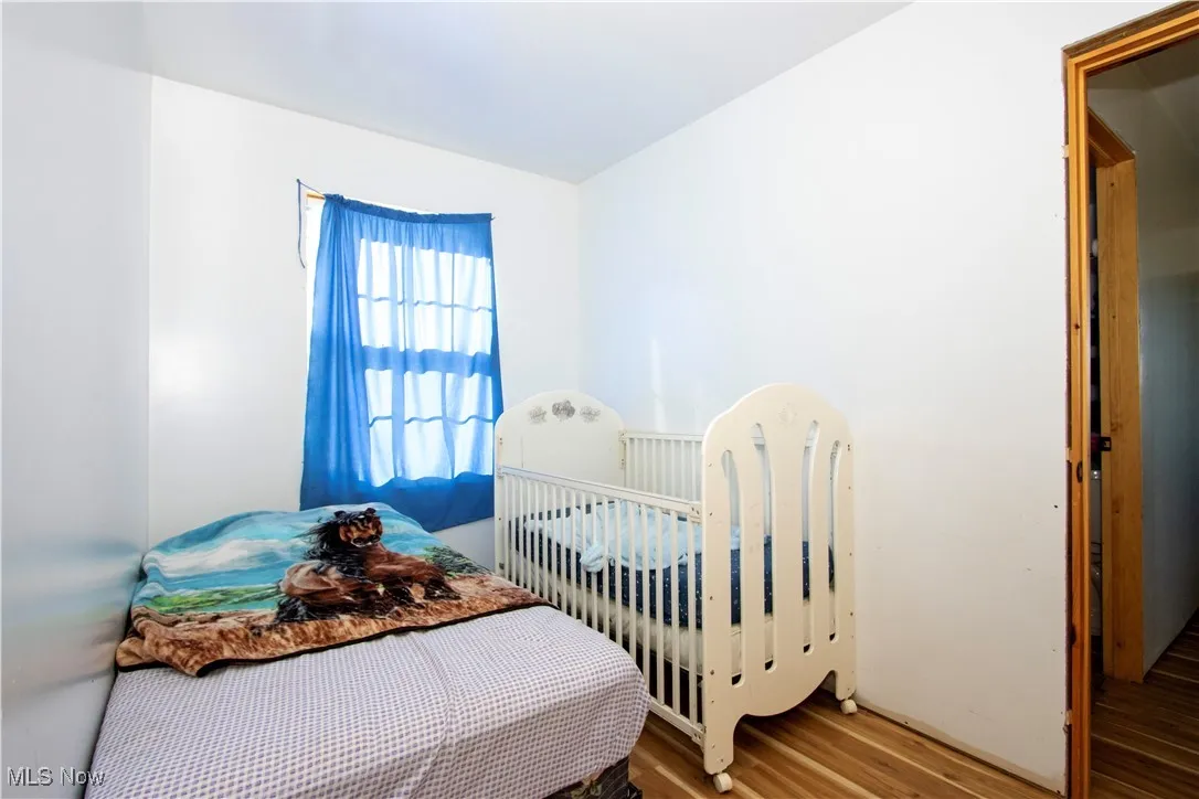Bedroom with wood finished floors