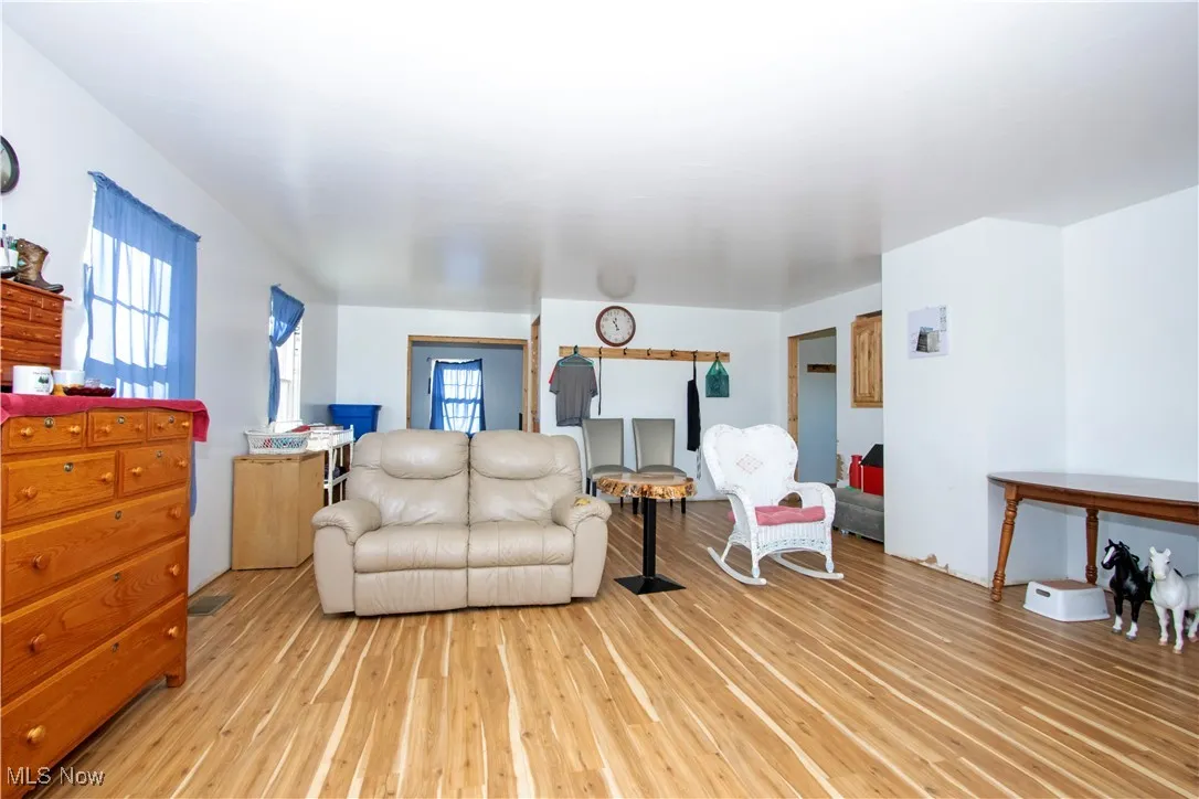Living area featuring healthy amount of natural light and light wood-style floors