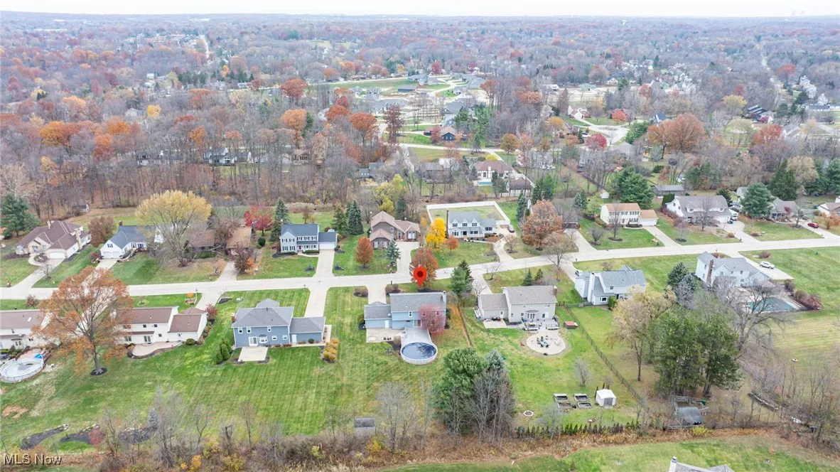 View of property location with nearby suburban area