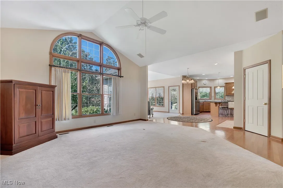 View from living room into kitchen and sunroom