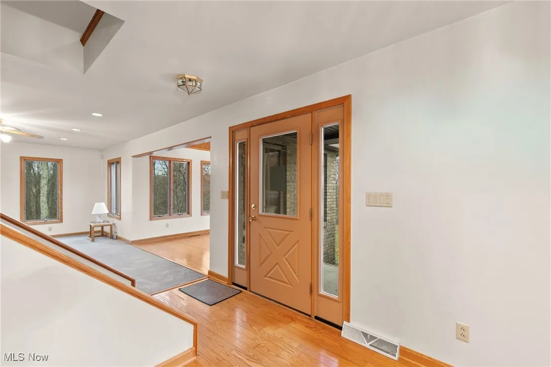 Entryway featuring light wood-type flooring and recessed lighting