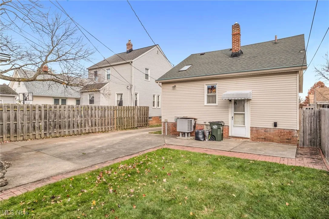 Rear of home with back door, patio and 220 spa box.