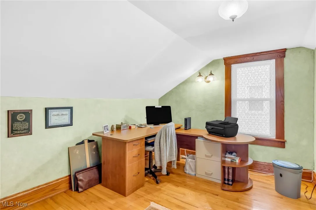 Third bedroom, upstairs, with hardwood floors, currently utilized as an office.