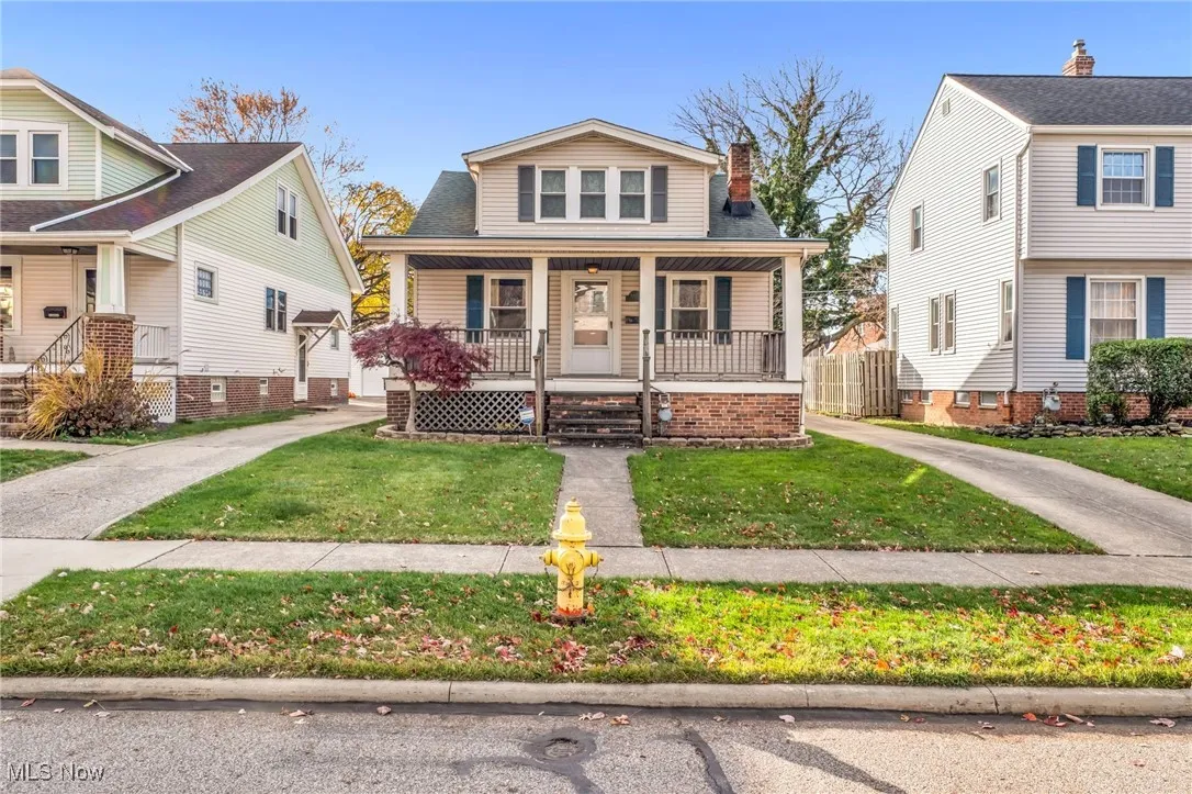 Classic 1919 home with welcoming covered front porch.