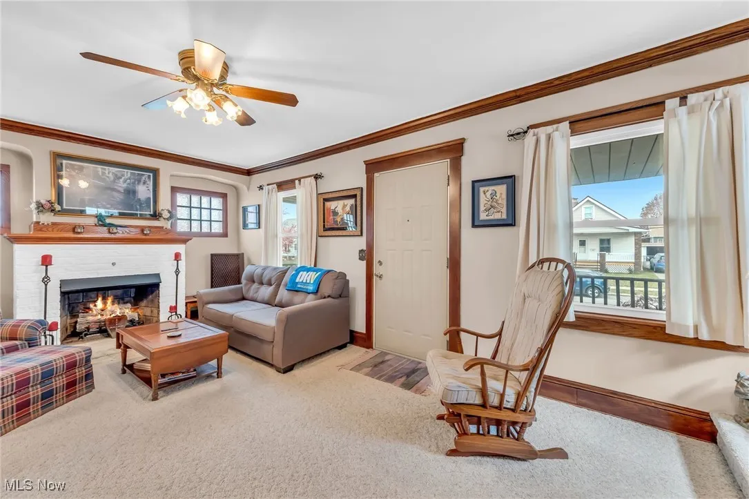 Living room with refinished woodwork and fireplace.