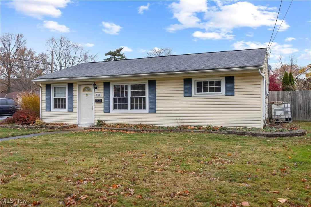 Single story home featuring roof with shingles