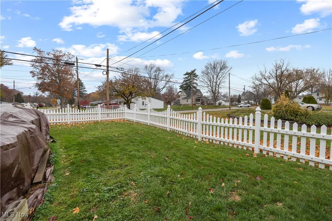 Fenced yard with a residential view