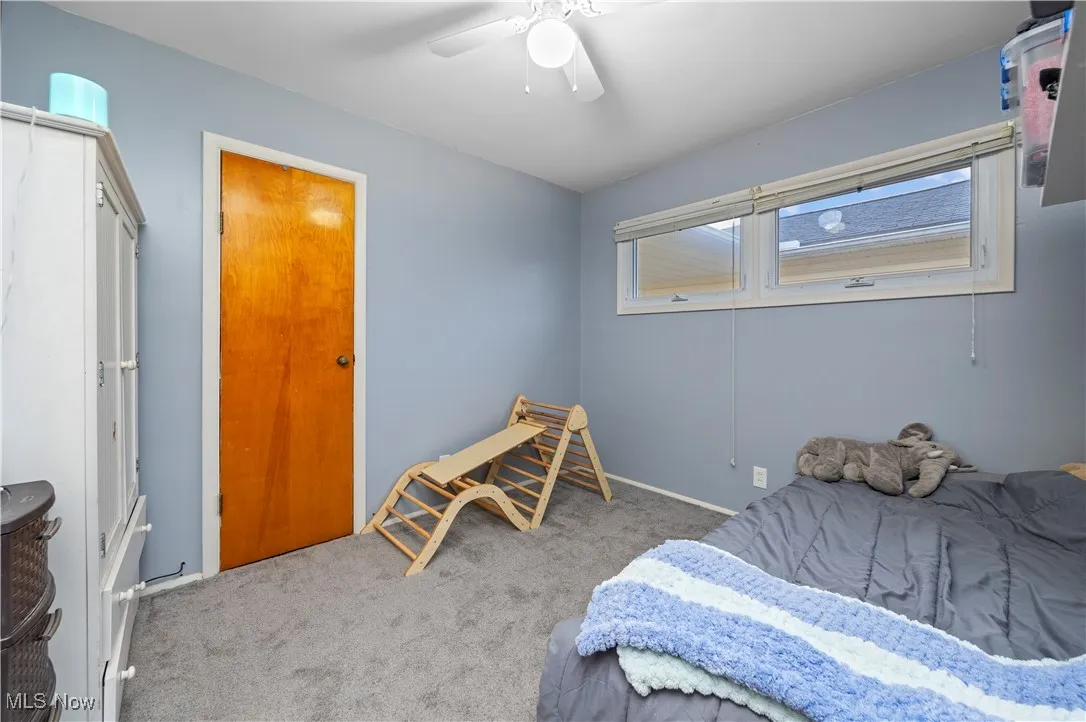 Bedroom featuring carpet flooring and a ceiling fan
