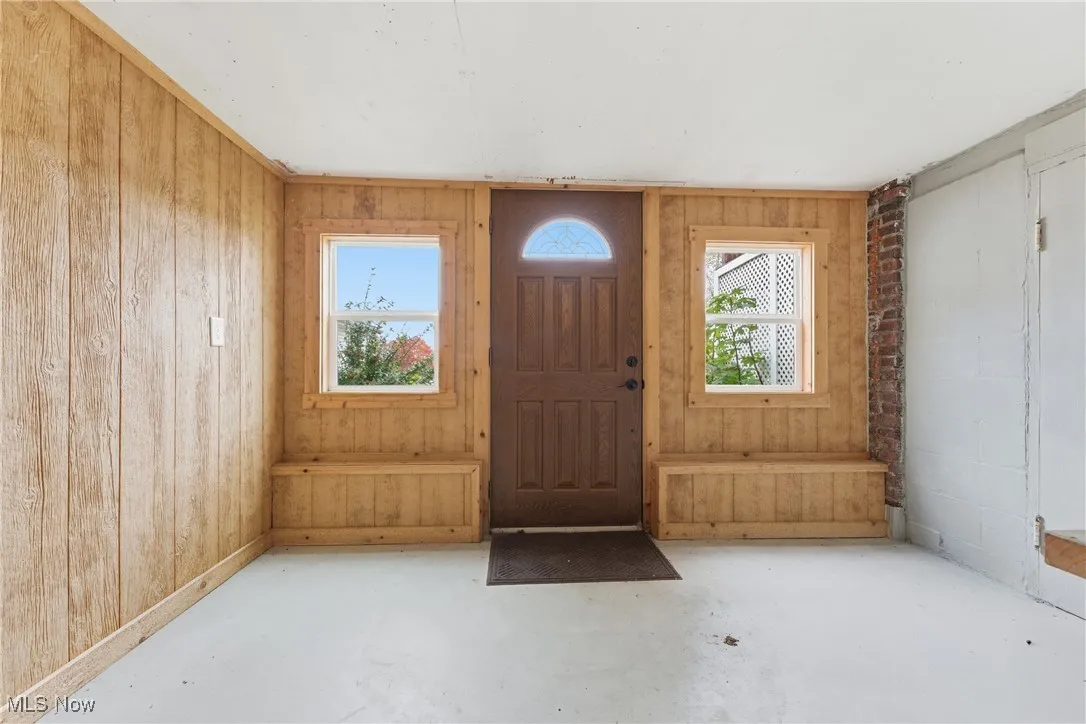 Foyer with concrete flooring