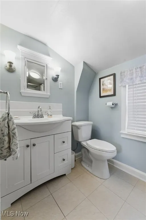 Bathroom with vanity and light tile patterned floors