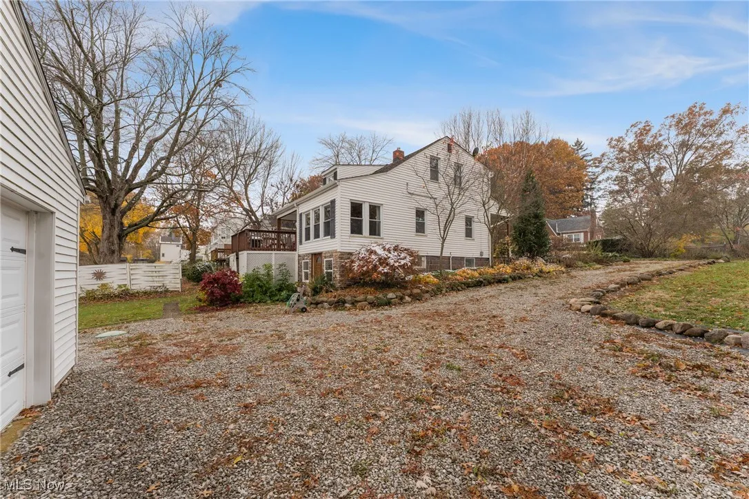 View of side of home with a chimney