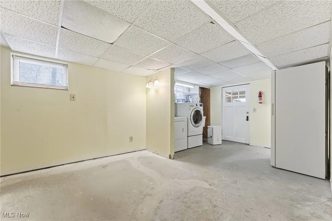 Below grade area with healthy amount of natural light and a paneled ceiling