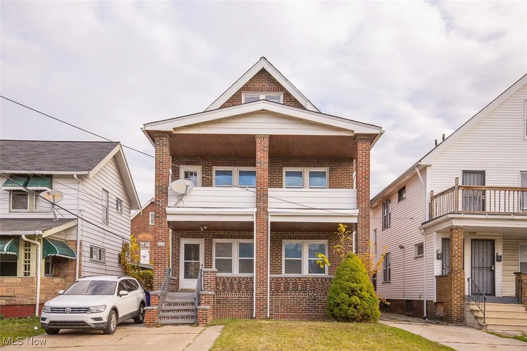 View of front facade featuring brick siding