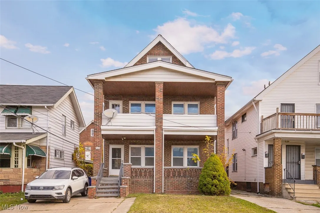 View of front of house featuring brick siding