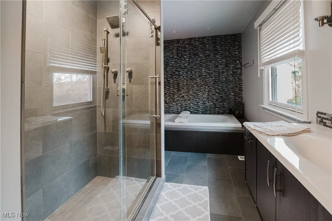 Tile floor, stand alone shower, jacuzzi