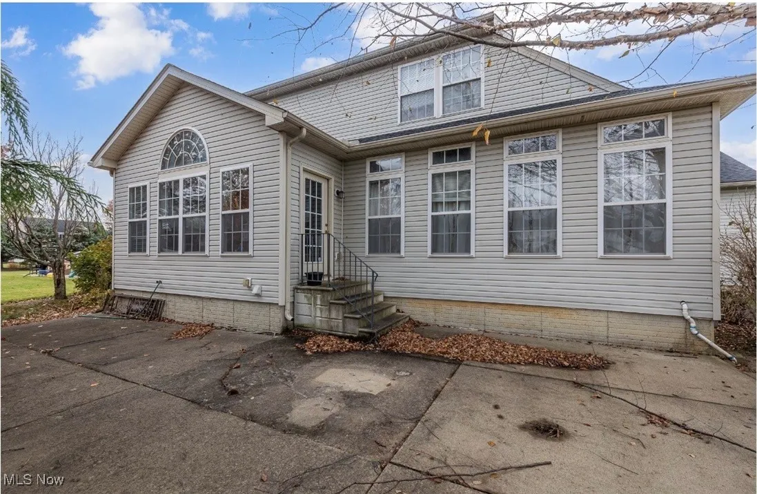 Back of property with entry steps