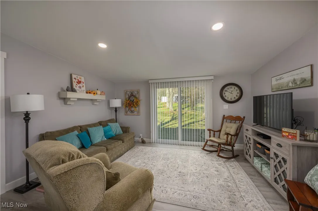 Living area with recessed lighting and wood finished floors