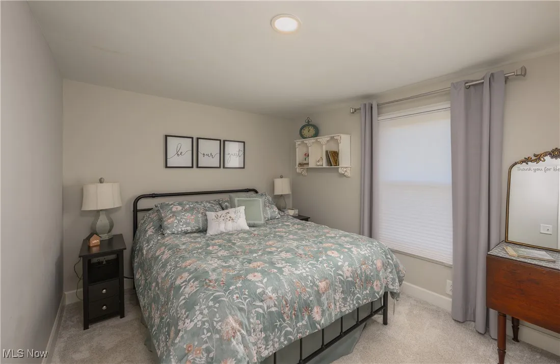 Bedroom featuring light colored carpet and recessed lighting