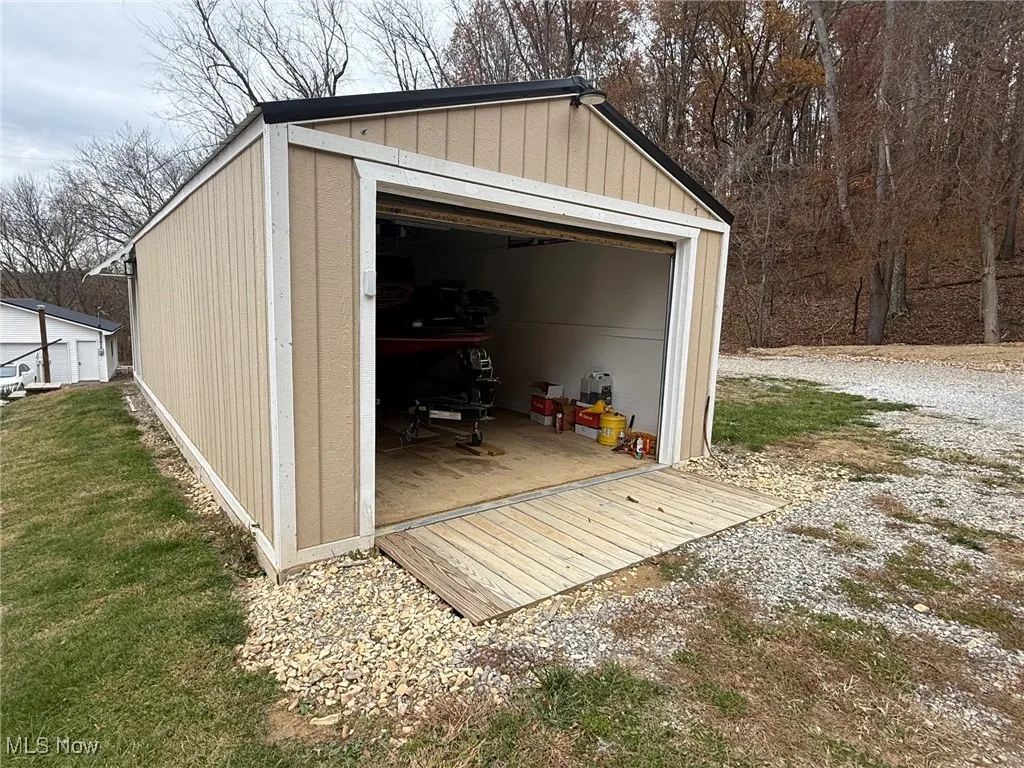 View of garage area of outbuilding