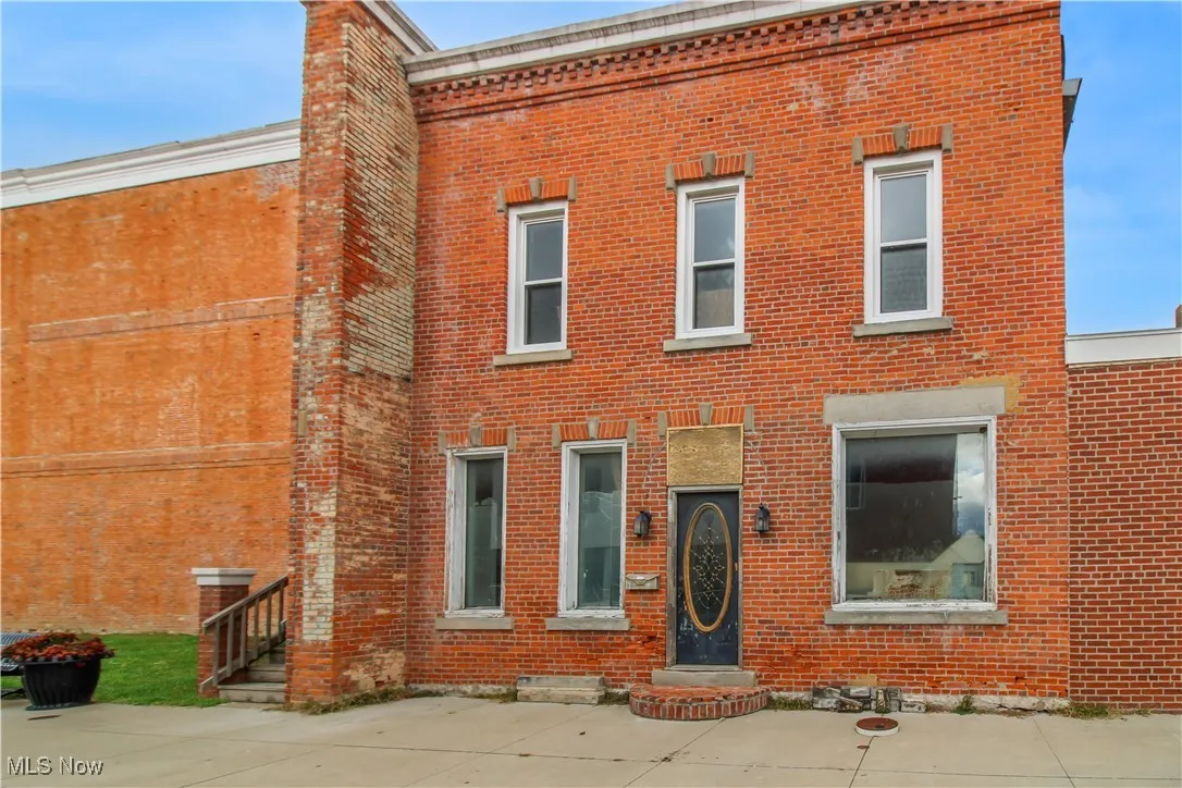 View of front of house featuring brick siding