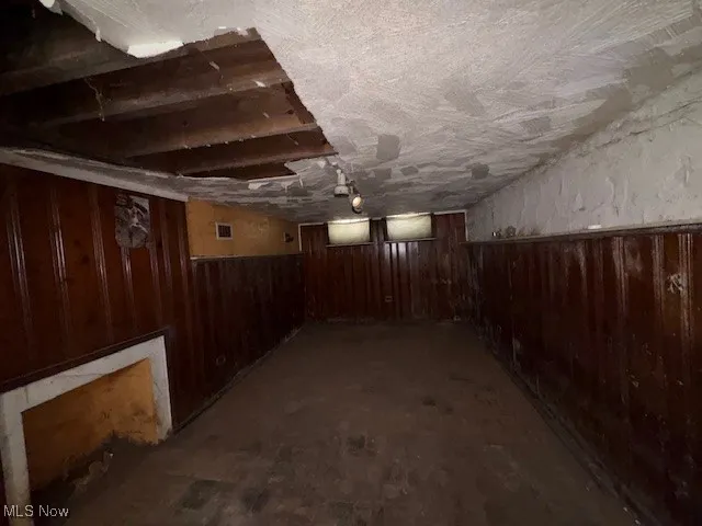 Unfinished below grade area with wood walls