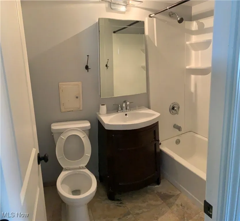 Bathroom with vanity and shower / bath combination